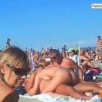 Topless amateur teens group beach photo