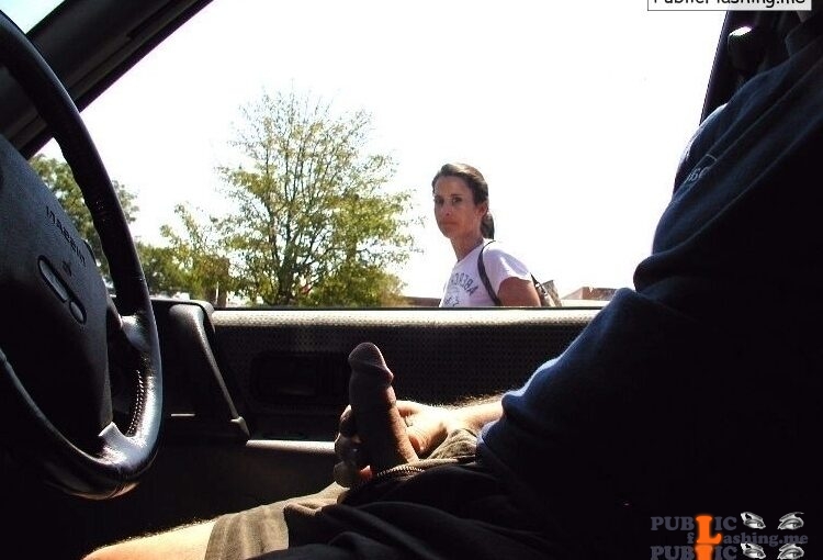 Girl is looking at guy who jerking off in a car