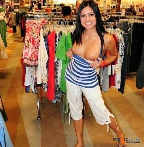 Cutie flashing boobies in store with a big smile