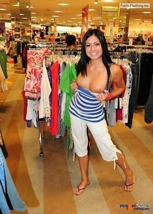 Cutie flashing boobies in store with a big smile Public Flashing
