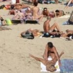 Topless selfie on the beach with nipple pokies
